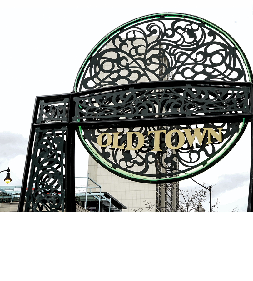 A black and green sign that says “Oldtown" on it. Description generated by AI