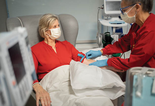Erin Oneill (Newport Beach Office Manager) acting as patient with Karen Delgadillo, RN at Newport Beach USC Norris Comprehensive Cancer - Keck Medicine of USC.