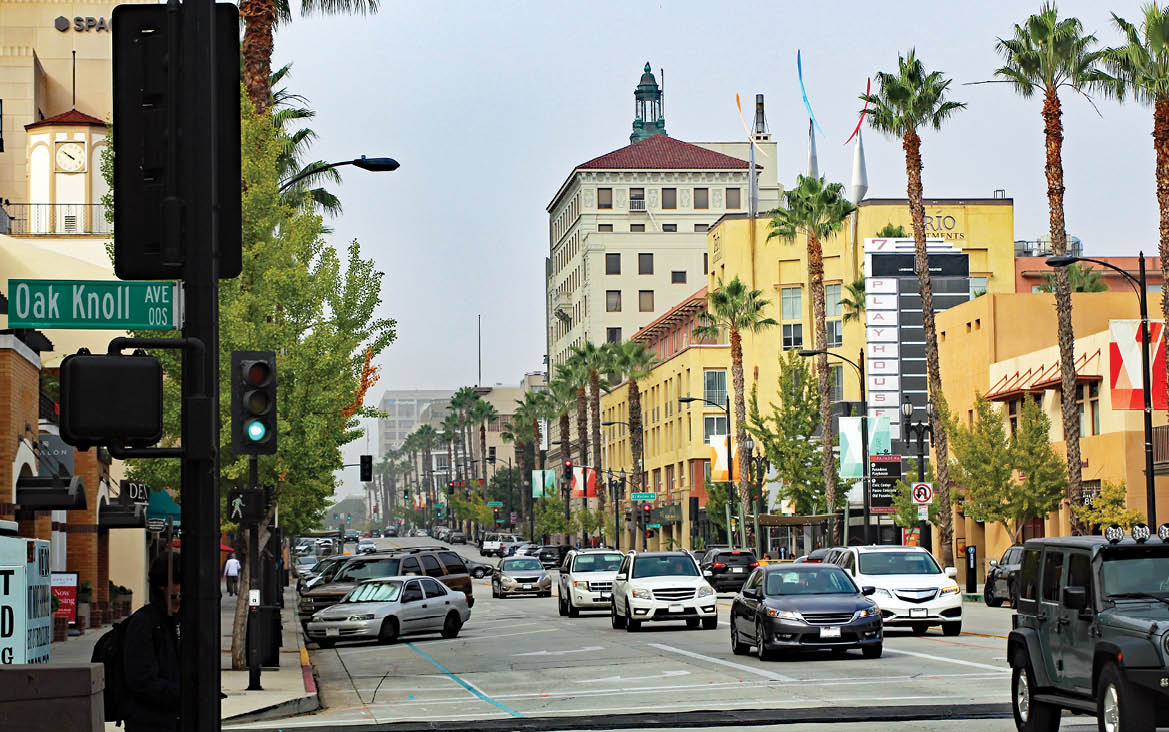 A busy street with cars and traffic lights. Description generated by AI