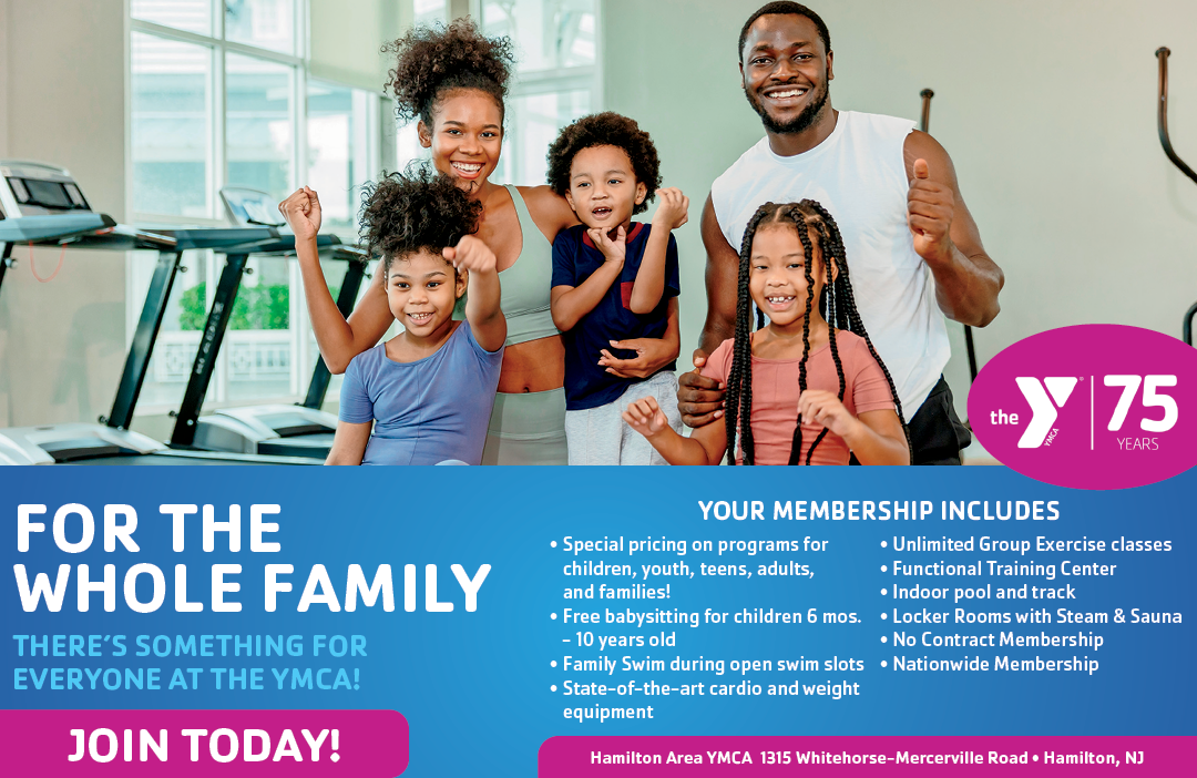 A family of four, including two adults and two children, are posing for a picture in a gym. AI generated content