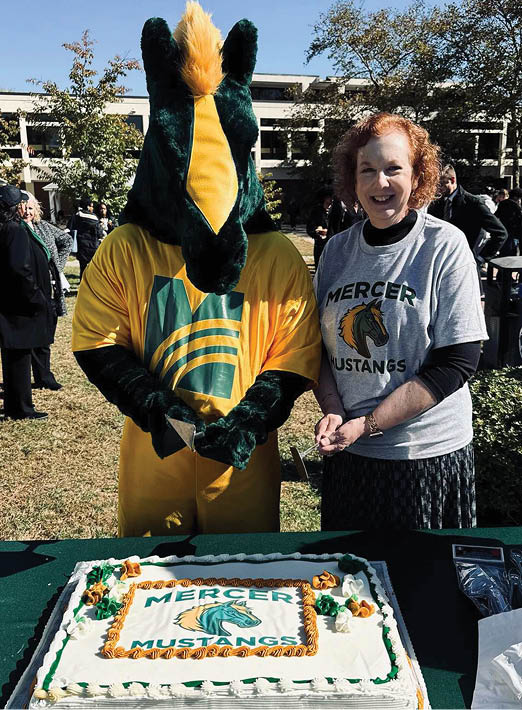 A man and woman are standing next to a table with a cake on it. The woman is wearing a grey shirt. AI generated content