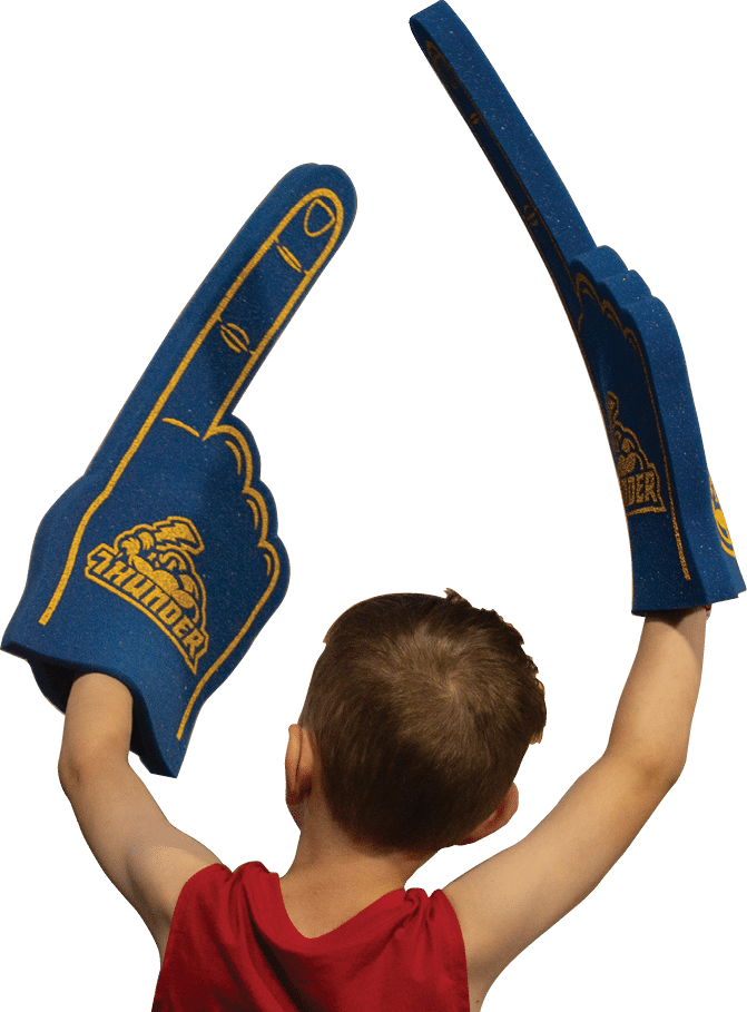 A boy wearing a red shirt and blue and yellow gloves. Description generated by AI