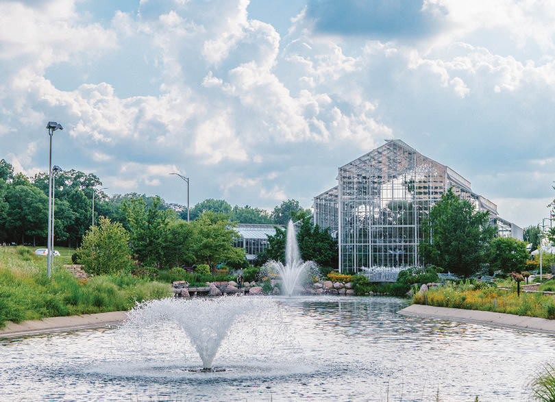 A fountain with water spraying out of it. Description generated by AI