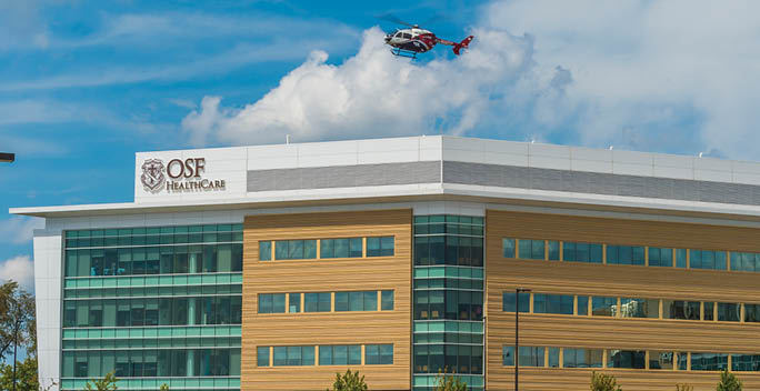 A helicopter is flying above a large building. AI generated content