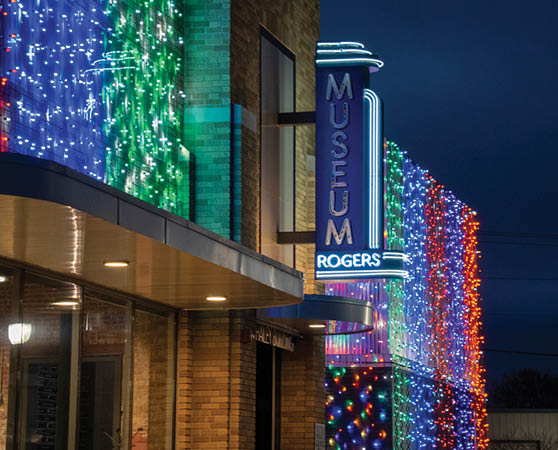A lit up museum sign with a blue, green, and red neon sign. AI generated content