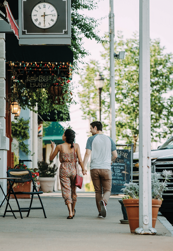 A man, woman, and two children are walking down a sidewalk. AI generated content