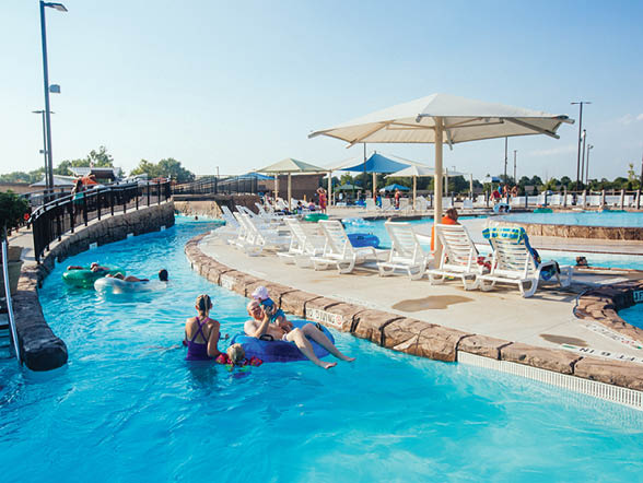 A group of people are swimming in a large pool. AI generated content