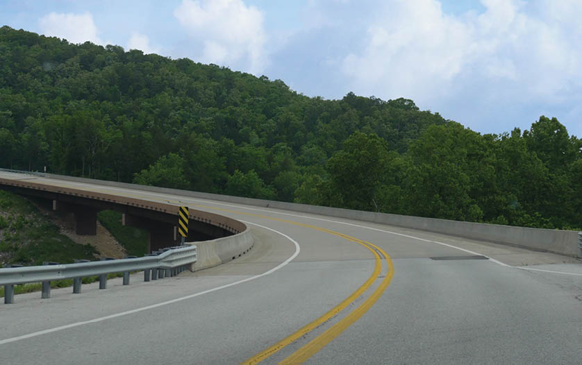 A highway with a bridge overpass and a tunnel. AI generated content