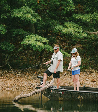 A man and woman are fishing on a lake. AI generated content
