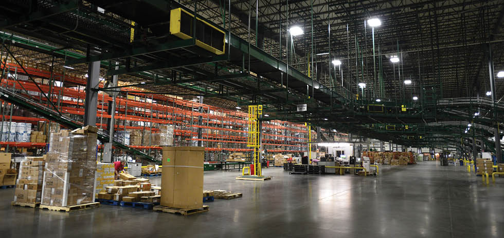 A large warehouse with a conveyor belt and a person working in it. AI generated content