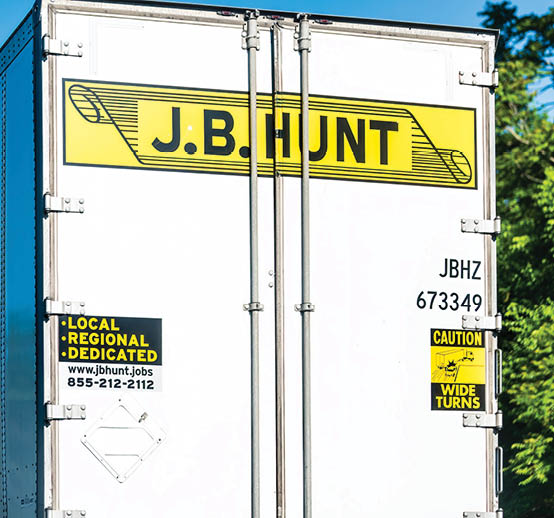 A white truck with the name J.B. Hunt on the side. AI generated content