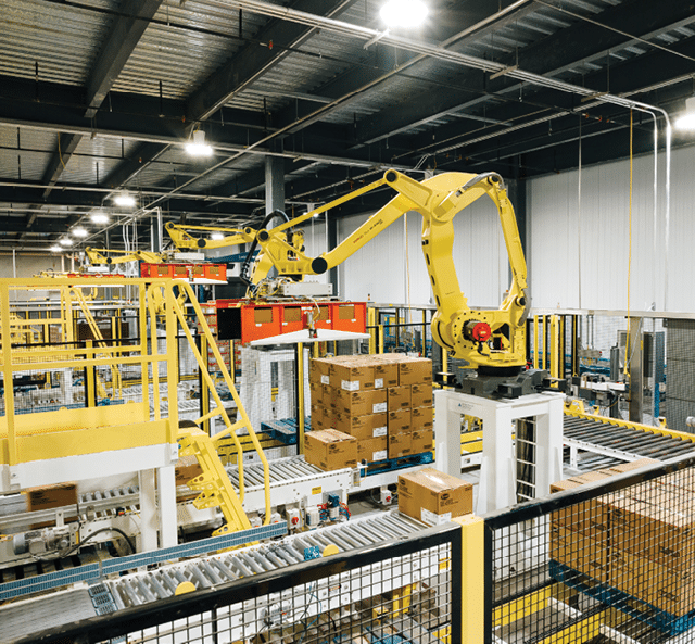 A factory with two large yellow robots working on a conveyor belt. AI generated content