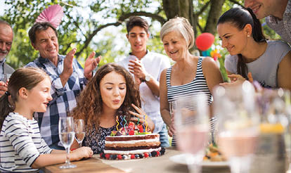 A group of people are gathered around a woman who is cutting a cake. AI generated content