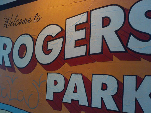 A sign welcoming visitors to Rogers Park. AI generated content