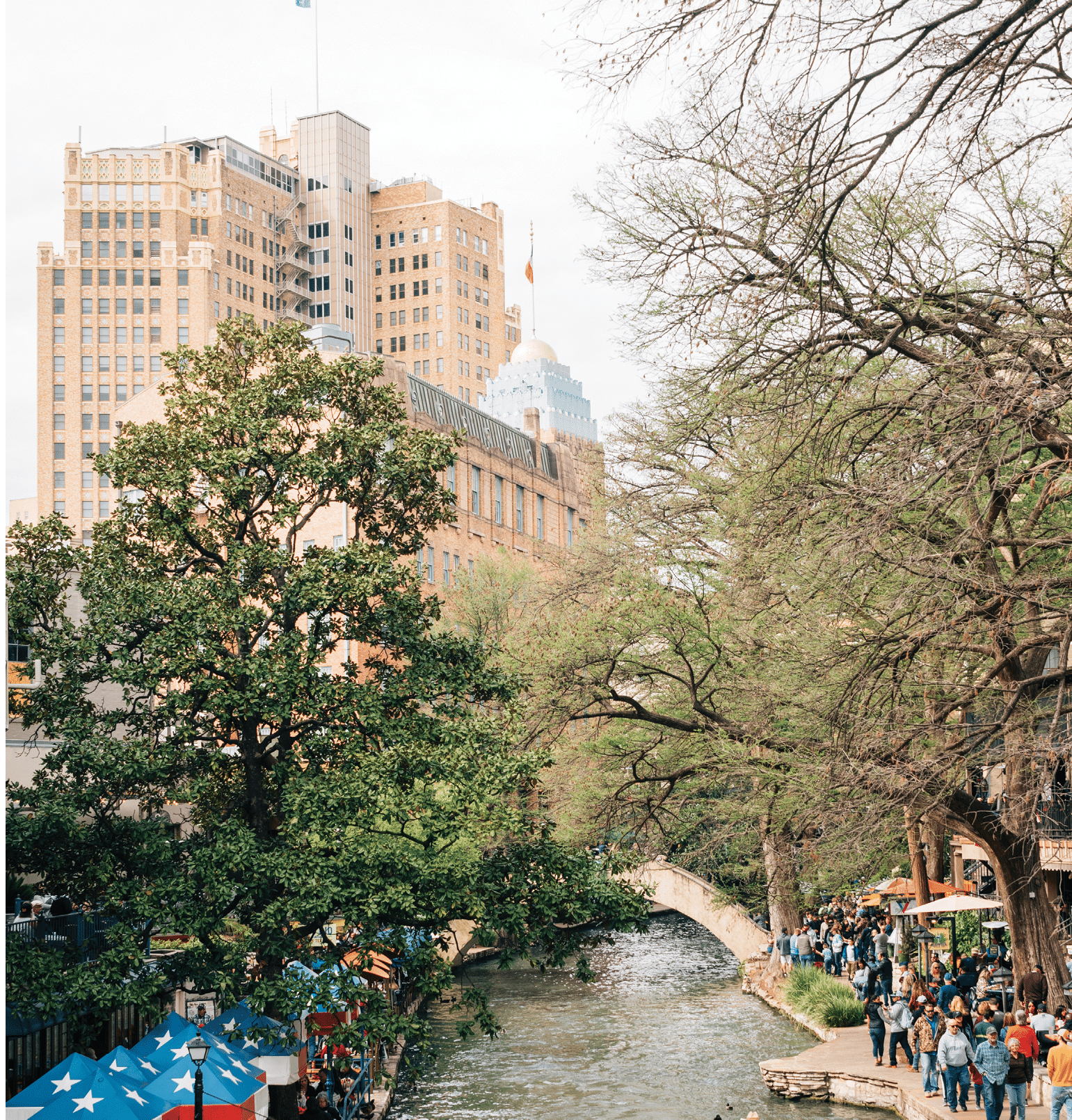 A boat and The Riverwalk in San Antonio, Texas