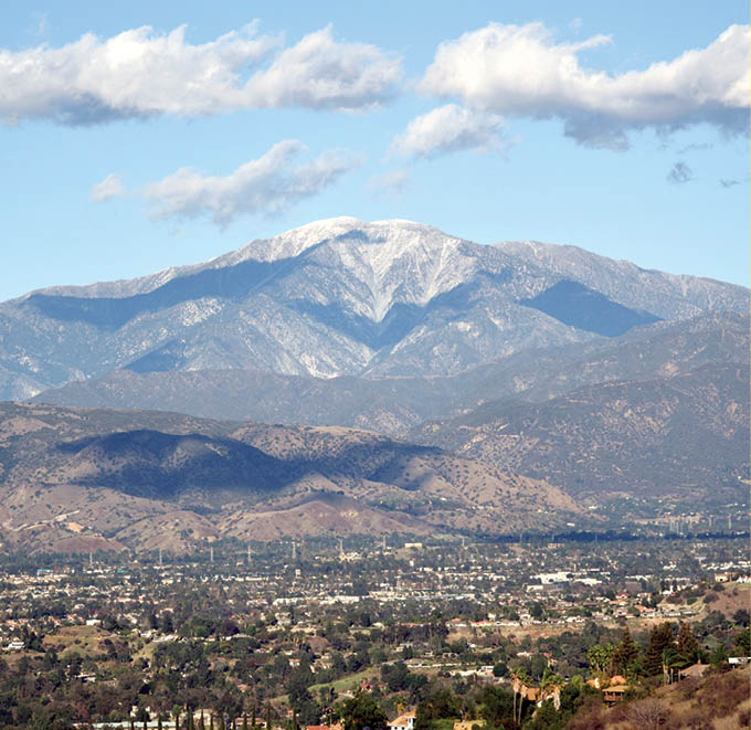 A snapshot of clouds passing over the San Gabriel Valley in Southern California...with Mount Baldy, the tallest peak in the San Gabriel Mountains, visible in the distance.