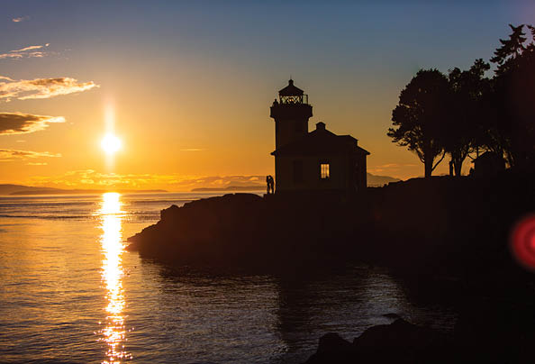 A lighthouse is visible in the distance. Description generated by AI