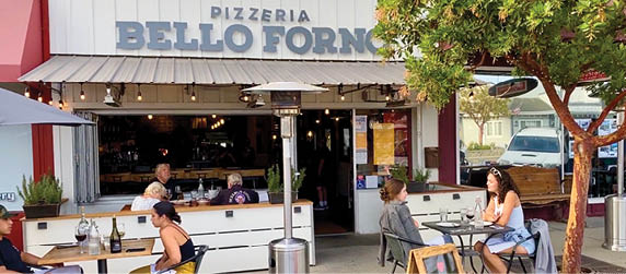 Photos provided by the Visalia Lifestyle Magazine in Santa Maria. This image is of Pizzeria Bello Forno in Old Town Orcutt has added seating along the sidewalk and parked its pizza oven food truck nearby in order to have safely distanced outdoor dining as well as true artisan wood fired pizza for curbside pickup