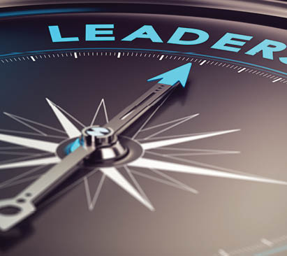 Compass with needle pointing the word leadership with blur effect plus blue and black tones  Conceptual image for illustration of leader motivation