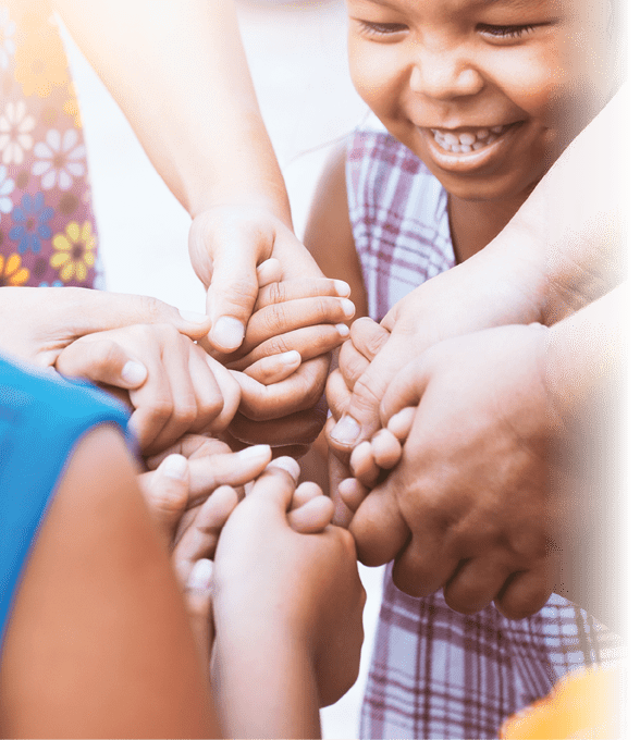 Children and parent holding hands and playing together with unity and teamwork