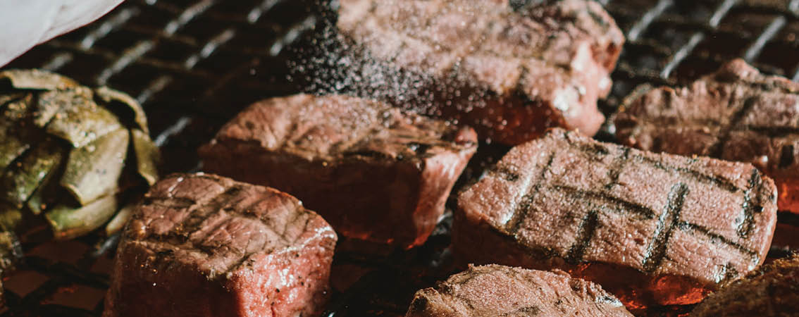Image of chef barbecuing tri-tip at the Hitching Post located near Santa Maria Valley in Casmalia, California 