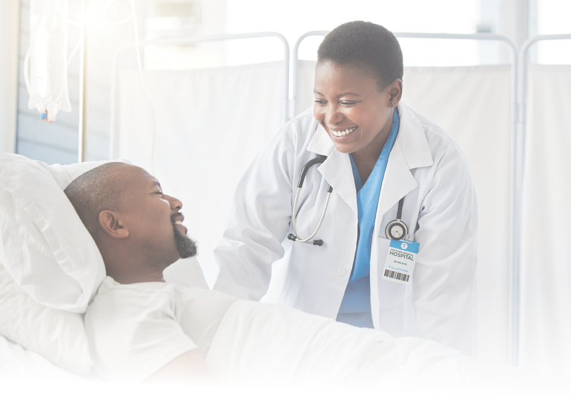 Inpatient care, healthcare insurance and doctor with patient looking happy with his recovery in hospital bed or health facility. Afro female medical physician talking health results to recovering man