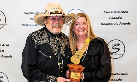 A man and woman are holding an award together. AI generated content
