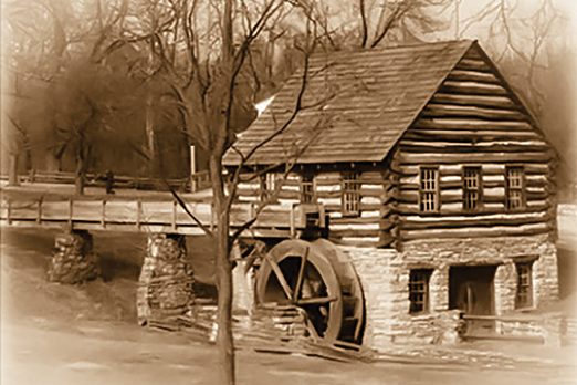 An old-fashioned building with a water wheel in front of it. AI generated content