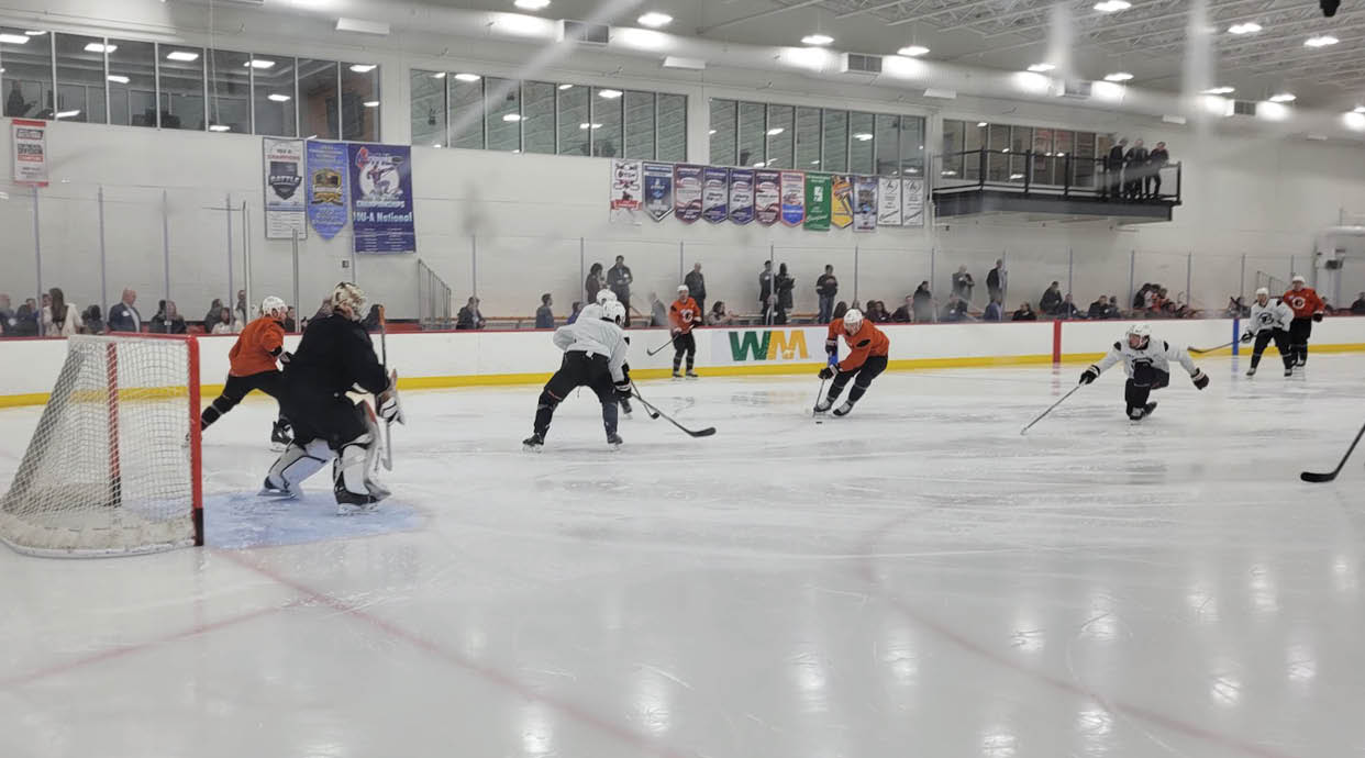 A group of hockey players are on the ice, some of them wearing helmets. AI generated content