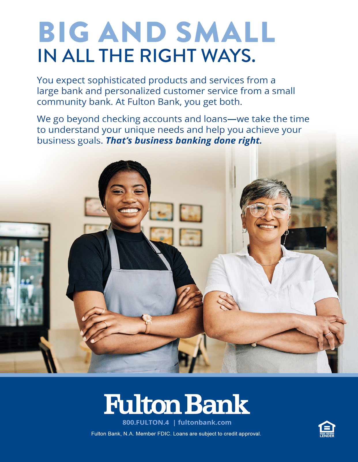 Two women in aprons stand in front of a Fulton Bank sign. AI generated content