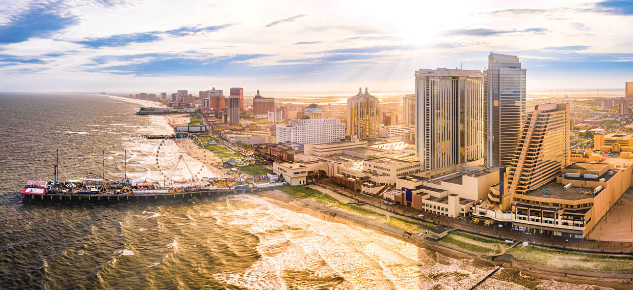 Late afternoon aerial panorama of Atlantic city along the boardwalk. Atlantic City achieved nationwide attention as a gambling resort and currently has nine large casinos.