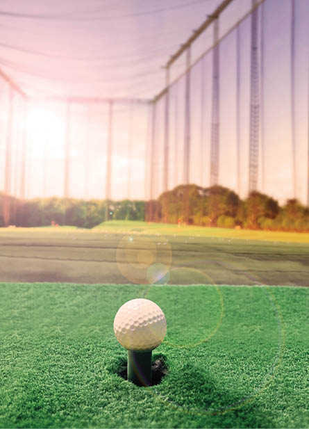 Golf practice range and beautiful white golf balls