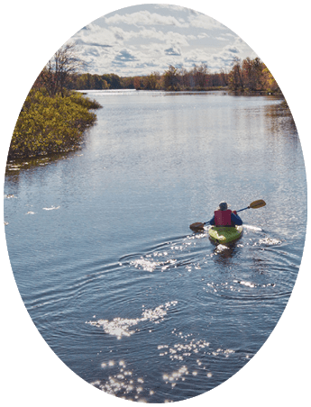 Sheila Cerwonka, paddles upstream on the Raquette River, October 15, from Ives Park in Potsdam , to view the remaining foliage and bird watch. Christopher Lenney/Watertown Daily Times