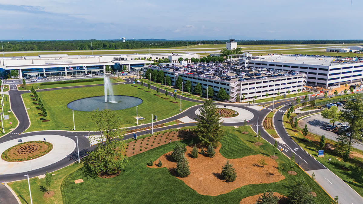 A large airport with a fountain in the middle and a roundabout. AI generated content
