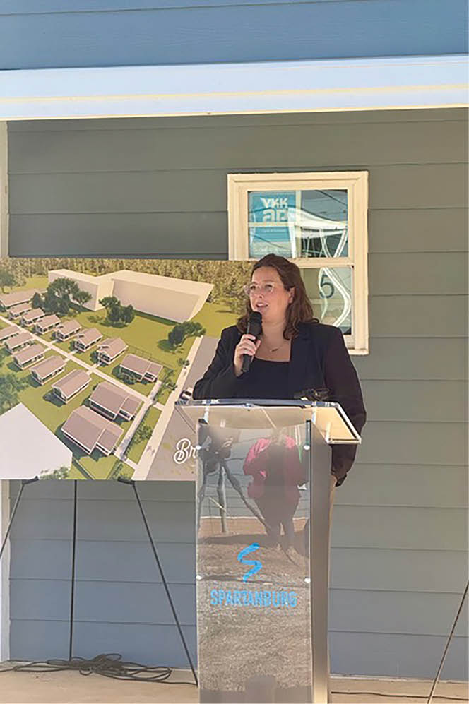 A woman is standing at a podium, giving a speech. AI generated content