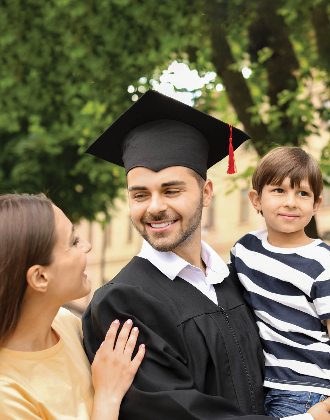 Happy man with his family on graduation day