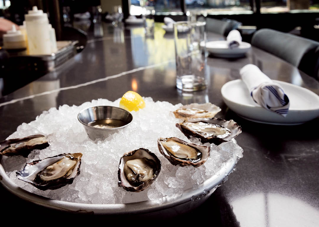 The Chelsea Farm Oyster Bar in Olympia, WA, was photographed for the Thurston Chamber of Commerce magazine The Voice, April 2025, by Shanna Paxton Photography.