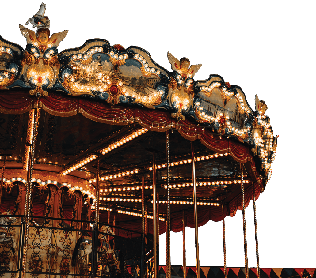Shiny golden children's magic carousel with horses Merry-go-roundi n the evening lights. Vertical