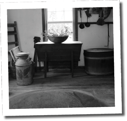 A room with a wooden floor and a table with a bowl on it. AI generated content