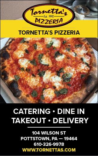 A pizza with green toppings is displayed on a card. AI generated content