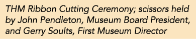 THM Ribbon Cutting Ceremony; scissors held by John Pendleton, Museum Board President, and Gerry Soults, First Museum    