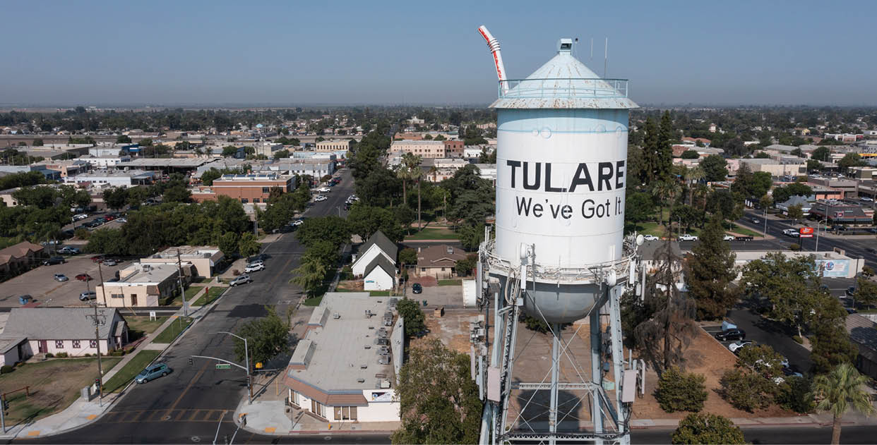 Tulare, California, USA - July 14, 2021: Morning sun shines on the downtown Tulare water tower.