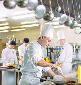 Modern kitchen. The chefs prepare meals in the restaurant's kitchen