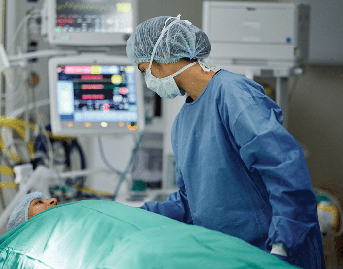 Bed, emergency or doctor with patient in surgery procedure or healthcare operation in hospital. Accident injury, people or surgeon in face mask helping in operating room in medical clinic at night