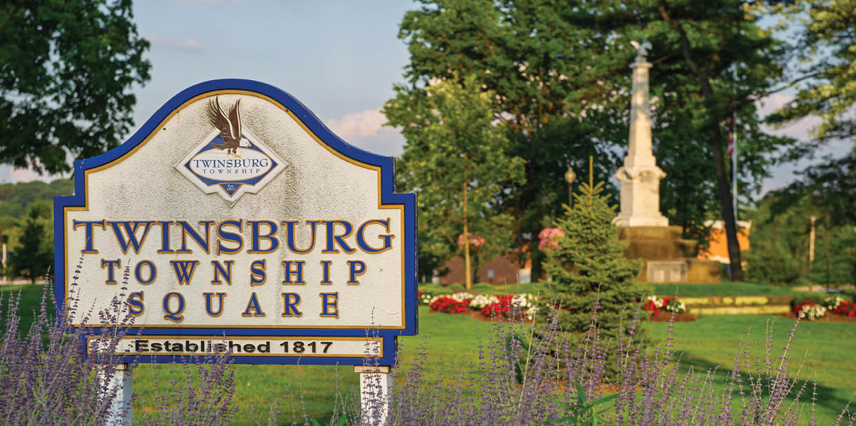 A sign that says Twinsburg Town Square. Description generated by AI