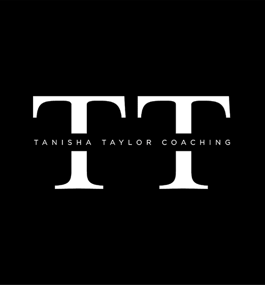 Two large white capital letters T with the words “TANISHA TAYLOR COACHING" written in small white letters between them on a black background. Description generated by AI