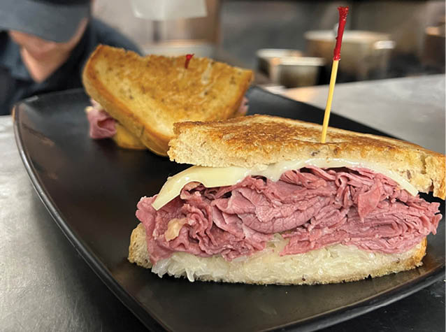 A plate with a sandwich on it. Description generated by AI