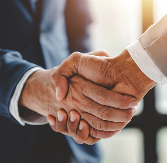 business partner handshake concept Colleagues shaking hands Successful deal after a great meeting. Blurred background.