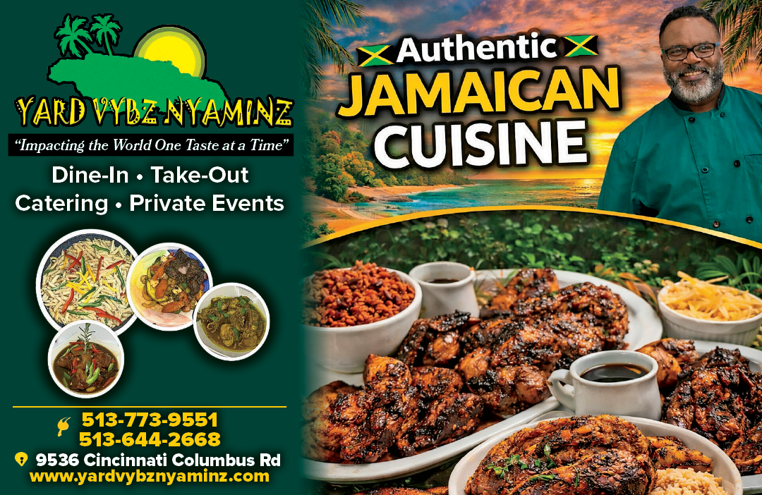 A man is smiling in front of a menu for Jamaican cuisine. Description generated by AI
