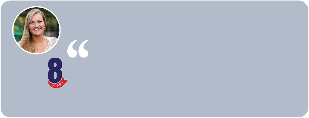 A woman with blonde hair and a blue shirt. Description generated by AI